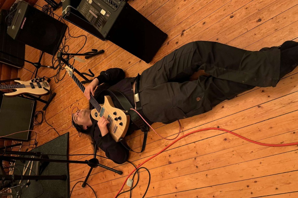 Builder with an LRH guitar on the studio floor